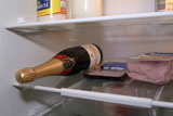 Bottle+of+champagne+and+ham+inside+of+a+refrigerator