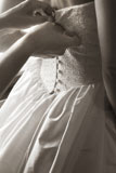 Close-up+of+a+bridal+dress+being+buttoned+%28+black+and+white+%29