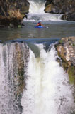 Man+Kayaking+Between+Falls