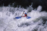 Man+Kayaking+Through+White+Water