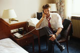 Man+on+Phone+in+Hotel+Room
