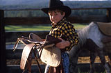 Cowboy+Holding+Saddle