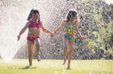 Girls+Playing+in+Sprinkler