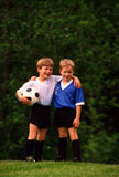 two+boys+posing+in+soccer+uniforms