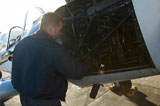 Airplane+mechanic+fixing+engine