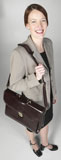 Smiling+businesswoman+carrying+briefcase