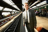 Businessman+on+train+platform