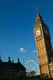 Low+angle+view+of+a+clock+tower+and+a+Ferris+wheel%2C+Big+Ben%2C+London+Eye%2C+London%2C+England