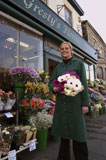 woman+standing+at+a+florist