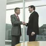 men+meeting+in+office+making+handshake
