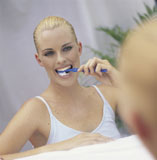 woman+brushing+teeth
