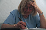 elderly+woman+making+notes