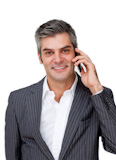 Confident mature businessman talking on phone
