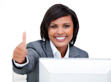 Confident businesswoman working at a PC