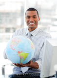 Businessman holding a terrestrial globe