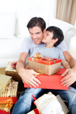 Son,kissing,his,father,after,receiving,a,Christmas,gift
