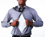 Businessman showing tshirt under his suit