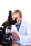 Attractive scientist viewing through microscope