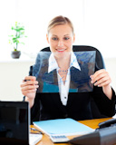 Confident businesswoman preparing slides for a presentation in her office