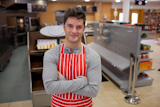 Assertive cook smiling at the camera