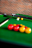 Close-up of a billiard with balls and cue