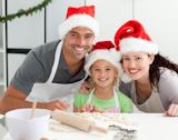 Happy family preparing Christmas cookies