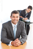 Cheerful businessman during a meeting with a colleague