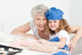 A,little,girl,with,her,grandmother,looking,at,the,camera