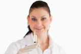 Smiling female doctor preparing a syringe