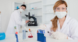 Two female scientists conducting an experiment
