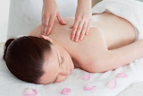 Cute redhead woman having a back massage