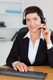 Portrait of a serious secretary calling with a headset