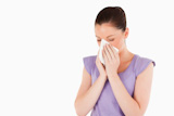 Good,looking,woman,sneezing,while,standing
