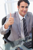 Portrait of a businessman working with a PC with the thumb up