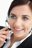 Businesswoman in black suit using a headset
