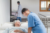 Nurse taking care of an elderly patient