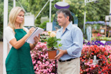 Gardener giving advice to customer