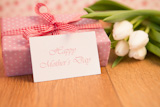 Pink,wrapped,present,with,happy,mothers,day,card,and,pink,rose