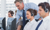 Group of agents sitting in line in a call centre