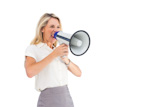 Businessman with hands on his ears because of megaphone