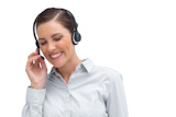 Smiling businesswoman talking on headset