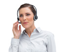 Businesswoman with headset looking down