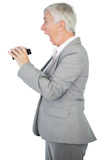 Happy businesswoman holding binoculars