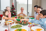 Cheerful,family,at,dining,table,for,christmas,dinner