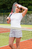 Pretty tennis player wiping her brow